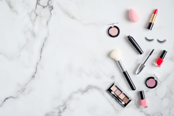 Makeup cosmetics and professional beauty products on marble desk. Flat lay, top view. Beauty blog...