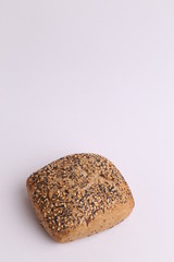 delicious bread rolls on colored background