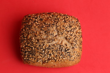 delicious bread rolls on colored background
