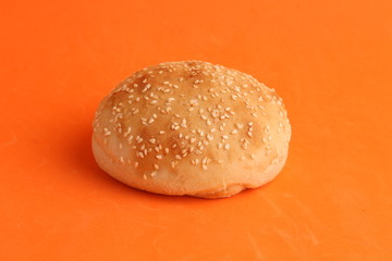 delicious bread rolls on colored background