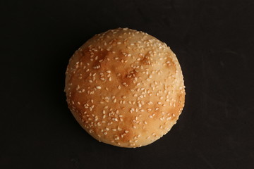 delicious bread rolls on colored background