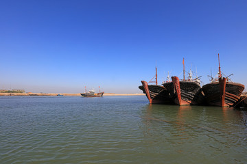 Naklejka premium Fishing boats moored at fishing port wharf, Luannan County, Hebei Province, China