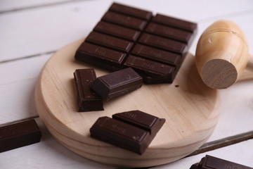 melting chocolate tablet in color background