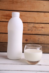 liquid yogurt bottle in color background