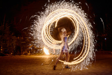 Amazing fire show at night outdoors, copy space