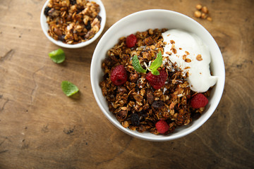 Homemade granola with raspberry and yogurt