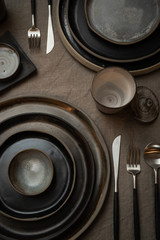 handmade kitchen ceramic plate set on  linen textile