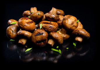 Champignon mushrooms cooked at the stake..