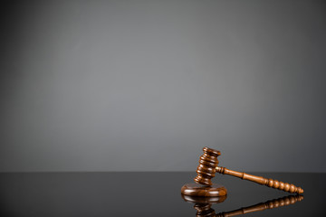 Gavel on gray background. Law, auction and business concept.  