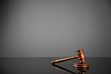 Gavel on gray background. Law, auction and business concept.  
