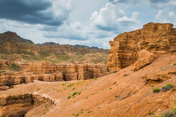 view of the canyon against a cloudy, stormy sky