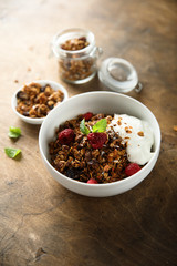 Homemade granola with raspberry and yogurt