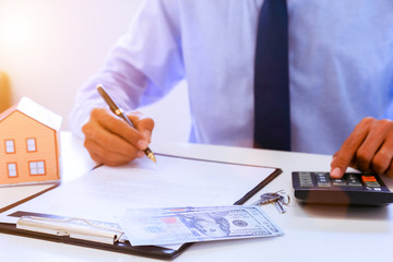 business man people working analyzing and calculate summary of cost from document chart and graph with calculator at office, Accounting and finance in the office.