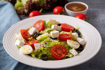 Fresh vegetables salad on a plate. Healthy and diet food concept.  Closeup