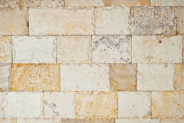 Texture of wall made of multicolored decorative blocks. Levels of bricks for interior decoration.