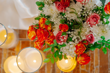 Beautiful decoration of the wedding table with flowers and candles.