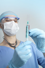 medical laboratory test tube and syringe with blood in the hand of a virologist doctor, concept of...