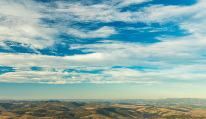 panoramic moody aerial landscape of highland valley hill land scenic environment cloudy blue sky background wallpaper nature photography with empty copy space for your text here