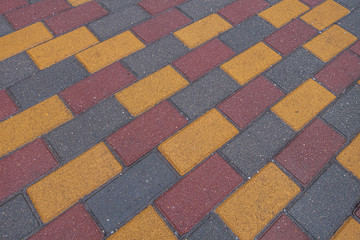 background of colored tiles on the track in the park