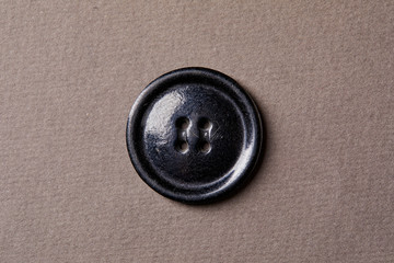 Obraz premium antique button on the brown background
