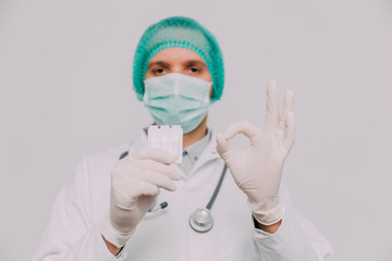 Male doctor with syringe and stethoscope.  Coronavirus epidemic concept.