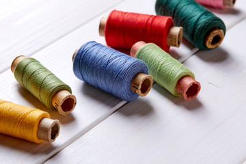 bobbins with thread and needles