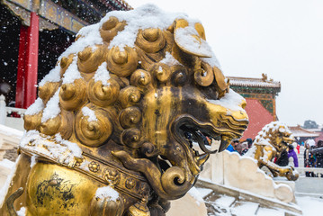 Lion statue in front of Gate of Heavenly Purity in Forbidden City, main tourist attraction in Beijing, capital city of China