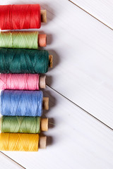 bobbins with thread and needles