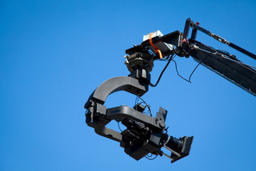 Image of a jib camera or camera crane with sky background 