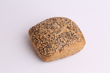 delicious bread rolls on colored background