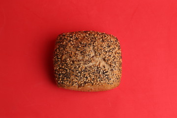 delicious bread rolls on colored background