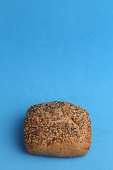 delicious bread rolls on colored background