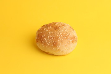 delicious bread rolls on colored background