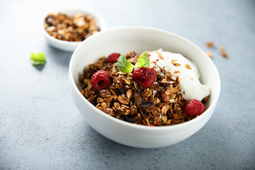 Homemade granola with raspberry and yogurt