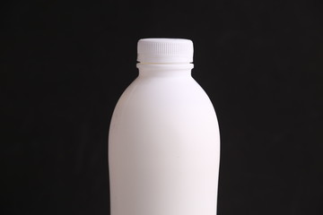 liquid yogurt bottle in color background