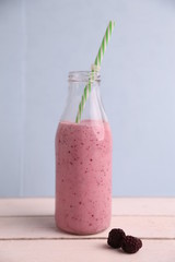 blackberry smoothie in color background