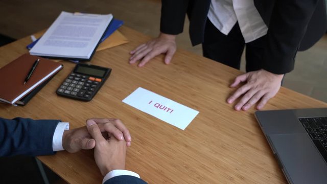 4k video of Business man sending resignation letter have i quit word to employer boss in order to dismiss contract, changing and resigning from work concept.
