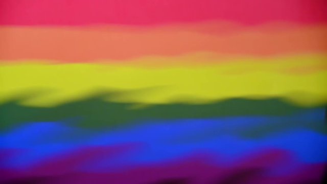 Gay Pride Flag reflection with ripples coming from the lower right corner. Abstract background concept