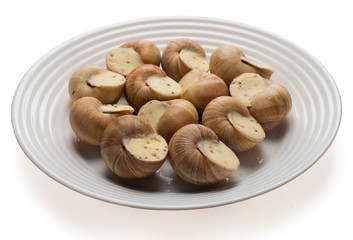 still life of stuffed snail sauce, on a white background