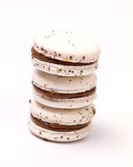 Stack of French Caramel Macarons Three White Macarons on White Background Vertical Close Up
