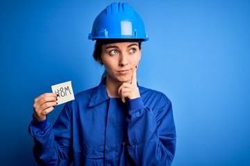 Beautiful worker woman wearing hardhat and uniform celebrating 8th march womens day serious face...