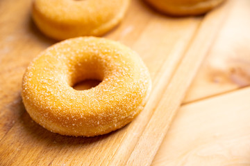 Donut with apple jam on the rustic background. Selective focus.