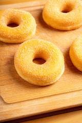 Donut with apple jam on the rustic background. Selective focus.