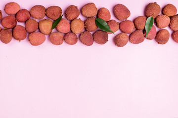 Flat Lay with Fresh and Tasty Lychee on Pink Background Top View Copy Space Organic Tasty Fruits