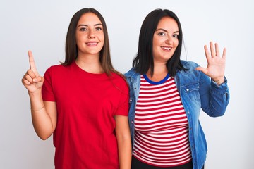 Young beautiful women wearing casual clothes standing over isolated white background showing and pointing up with fingers number six while smiling confident and happy.