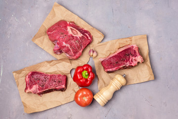 Raw Marinated Spicy Pork Meat Ripe Pepper and Tomato Pepper Mill Top View Flat Lay