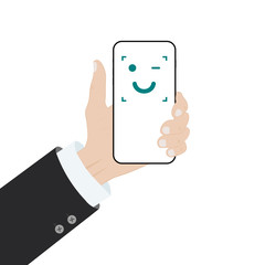 Facial recognition concept. Face ID, face recognition system. Hand holding smartphone with human head and scanning app on screen.