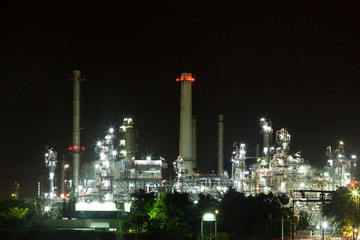 Fototapeta premium Oil refinery environmentally friendly, with sky and clouds, river
