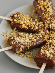 Chocolate ice cream with nuts. Raw desserts