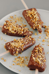 Chocolate ice cream with nuts. Raw desserts